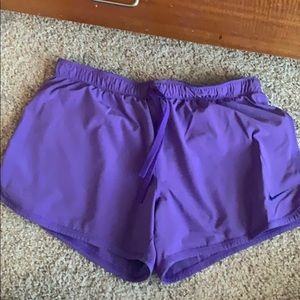Purple Nike Dri-Fit with spandex shorts underneath